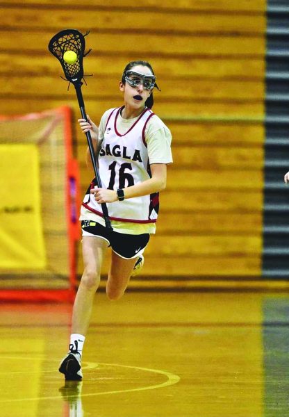 New goal…strengthening her skills, Freshman Addie Yost is at practice for lacrosse to improve her skills in order to become a better player for the upcoming season.
