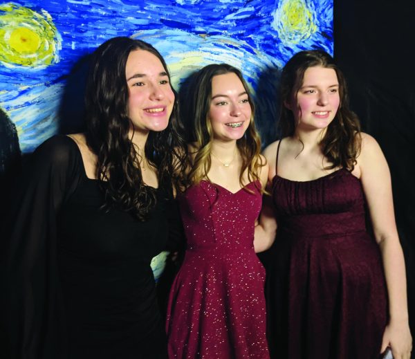 Written in the “Starry Night”...Enjoying the Winter Ball on January 27, (from left) sophomores Alaina Picard, Ashlyn Everitt and Kaitlyn Caldwell commemorate the evening with a photo.