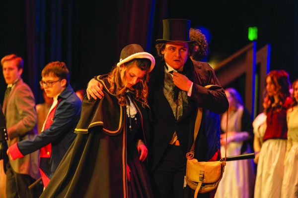 On the run...Fleeing from Inspector Javert, played by senior Jackson Rohrbaugh, Cosette, played by junior Shannon Stover, and Jean Valjean, played by senior Hunter Haight, attempt to keep their true identities a secret during the April 12 performance of “Les Miserables” .
