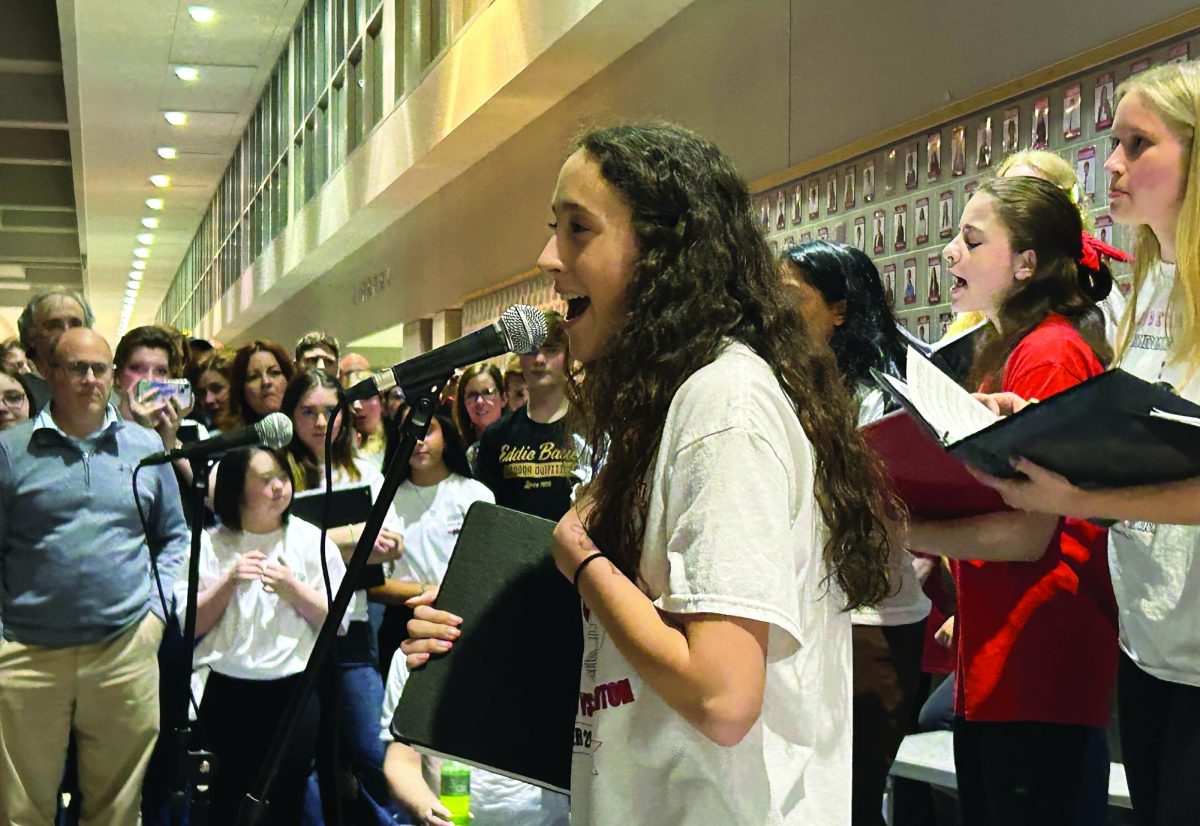 Demonstrating her work as part of Souderton’s womens’ a capella group, Chordination, senior Ava Mills performs “Bills Bills Bills” by Destiny’s Child. Chordination was just one of many student music groups that performed at Music in Our Schools Night on March 6.