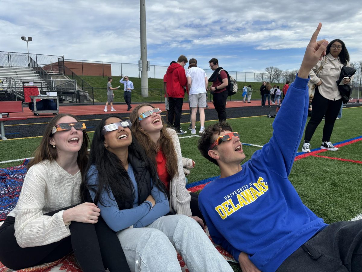 Awestruck...Observing+the+last+total+eclipse+over+the+United+States+until+2045%2C+%28from+left%29+seniors+Allie+Thatcher%2C+Anya+Patel%2C+Anna+Stratton+and+Ryan+Ciuba+admire+the+event+on+April+8.+