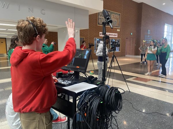 Directing the action…During the March 15 live RedAlert broadcast, senior Zach Gross directs the action. RedAlert produces a show every Friday.