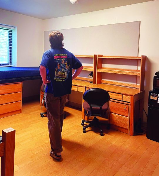 Taking it in...Surveying his dorm room before heading home for the summer, University of Colorado Boulder freshman Patrick Rother reminisces about his first year in college.