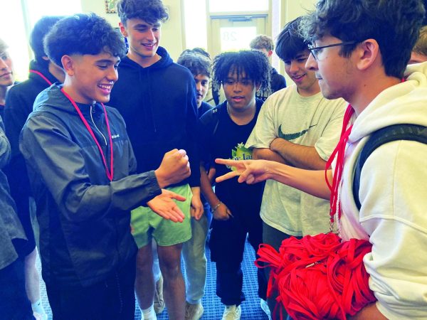 Rockin’ it...Throwing rock, sophomore Manny Coronado (left) defeats junior Nolan Mancini during The Gauntlet portion of Unified Track’s April 26 Rock Paper Scissors Tournament, held in the student center.