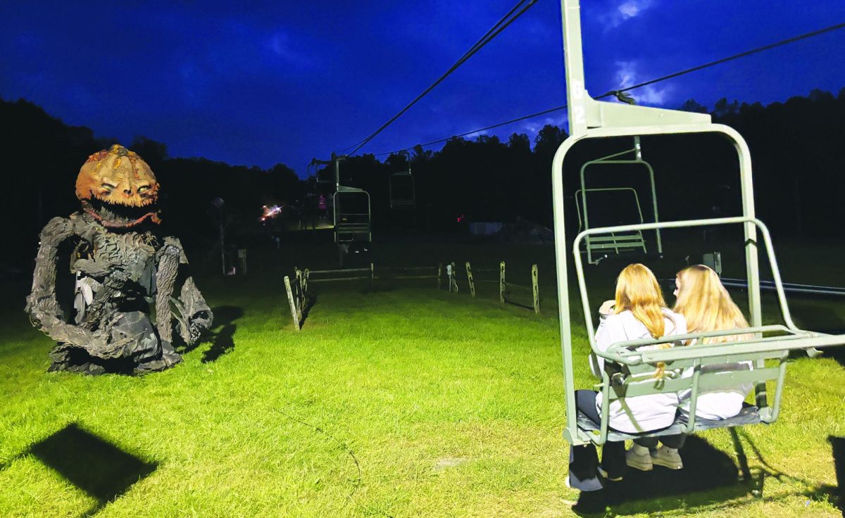 Overcoming their fears… Riding to the top of Spring Mountain, eighth graders Samantha Gehris and Bailey Pershpalaj anticipate a walk-through and hayride of horror at Spring Mountain’s Scream Mountain.