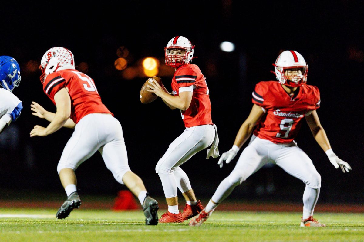 Keeping calm…Stepping up to complete a pass, junior Ben Walsh (center) stays protected behind senior Evan Meenan (left) and senior Houston Marshall. The Souderton Indians defeated the Bensalem Fighting Owls 44-14 during the October 5 Homecoming game, advancing to 5-3.