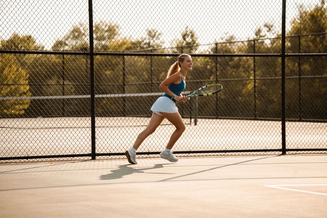 Serving style… Running on the court, sophomore Leah Kane practices her tennis skills, specifically by playing matches with her other teammates on August 3 2024. 
