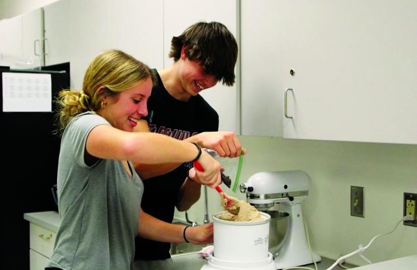 Sprinkling kindness…Making homemade ice cream, Key Club members Hannah Pollack (left) and Sawyer Jones hope to uplift the senior community’s spirit for a social event at Living Branches. This event took place on November 16, 2023.