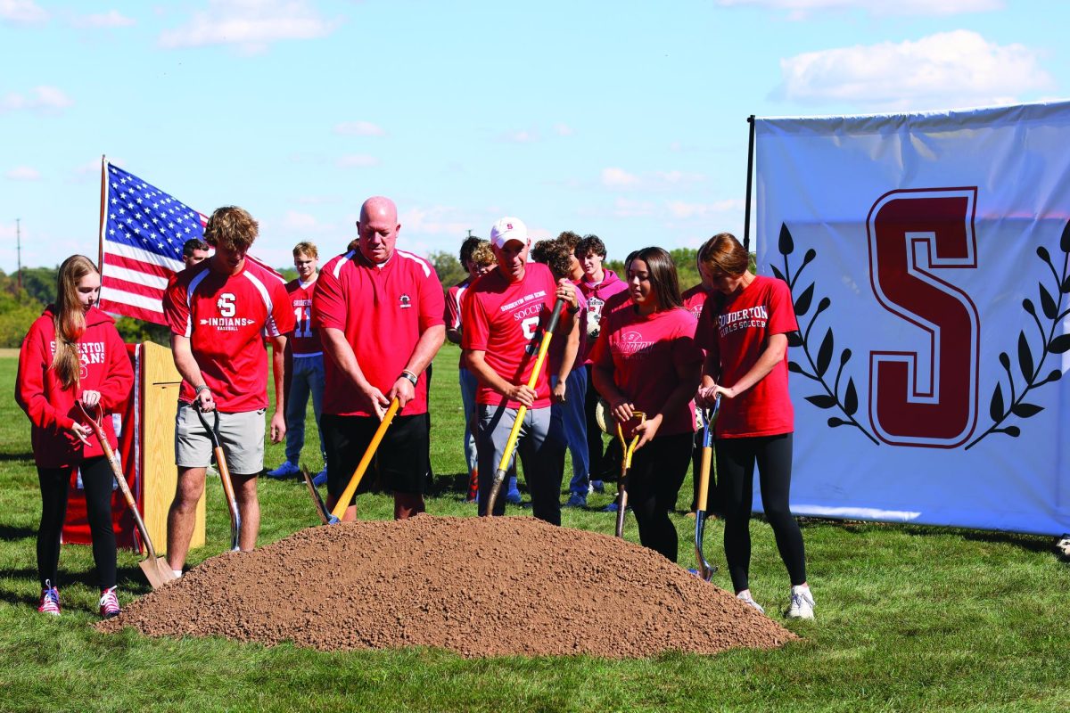 Digging in…Kicking off the October 9 ceremony for the new athletic field, (from left) sophomore Julia Rueger, senior Tyler Lutz, baseball coach Michael Childs, boys soccer coach Frank Demas, senior Josi Tolentino and sophomore Lily Heron make the first dig.