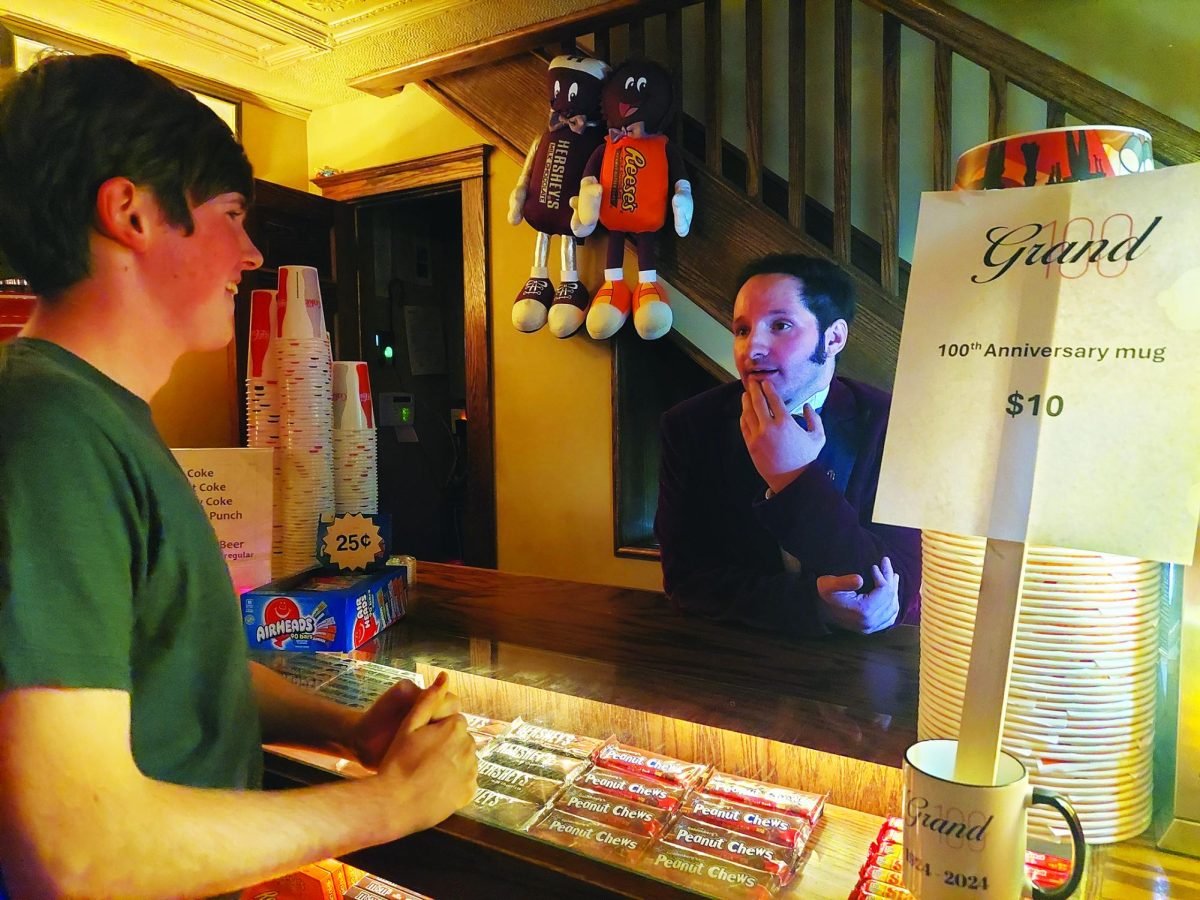 A ‘Grand’ experience…Preparing to open to the public on November 7, Grand Theater concession supervisor Trent Kurdes (left) and general manager Newt Wallen discuss last minute jobs.