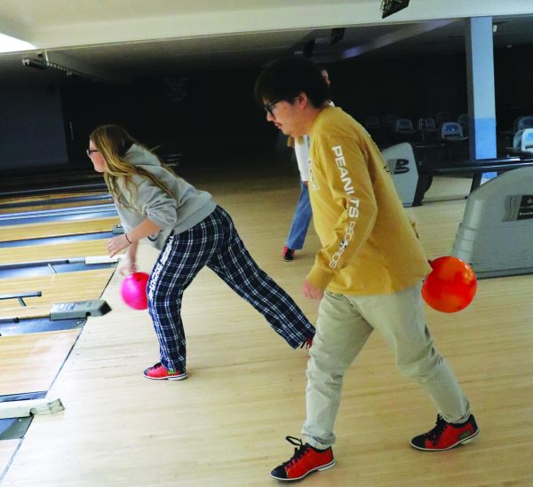 Striking together…Getting ready to knock down some pins, STARR member Sean Camacho and senior Jackie Fretz release their bowling balls. Unified Bowling met every Wednesday in October at Earl Bowl Lanes, finishing their meetings on October 24.