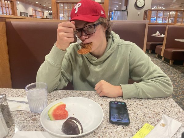 Feasting for the winter…Chowing down on a chicken finger, senior Aidan Cassidy tries to finish his third plate of food at Shady Maple Smorgasbord in East Earl, Pa. Cassidy also enjoyed some fruit and dessert before finally calling it quits.