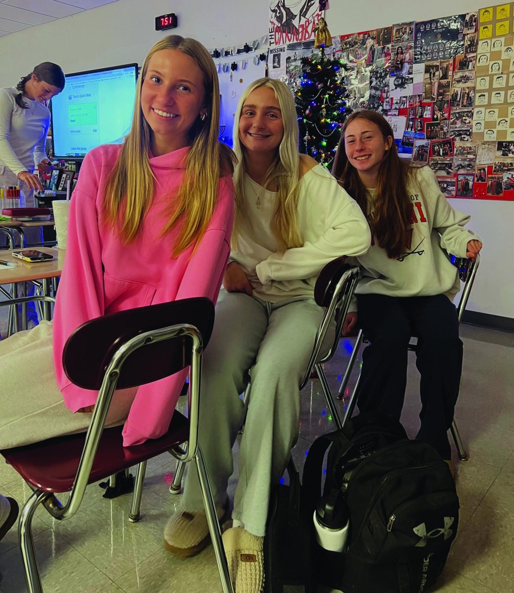 Spreading kindness… Working on creating motivational posters for around the school, club members (from left to right) Cammy Moyer, Lilly Fisher and Lilly Herron sit together at the first meeting of the Morgan’s Message club in December.