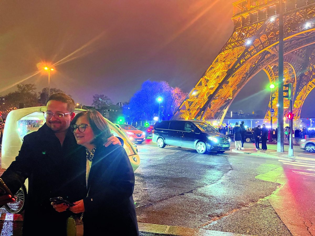 City of Love...Embracing a scenic view at the Eiffel Tower in December 2024, Souderton residents Alvaro and Maria Camacho snap a selfie. Visiting the Eiffel Tower during the holiday season is a way for some to enjoy their time in Paris.