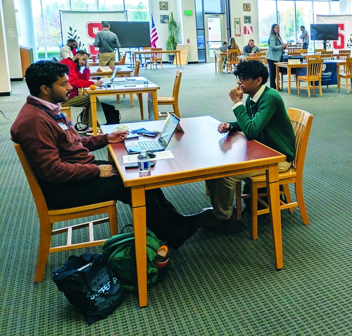 Interviewing with a goal…Thomas Jefferson college rep holds an interview for a possible college acceptance with senior Abel Mathew.