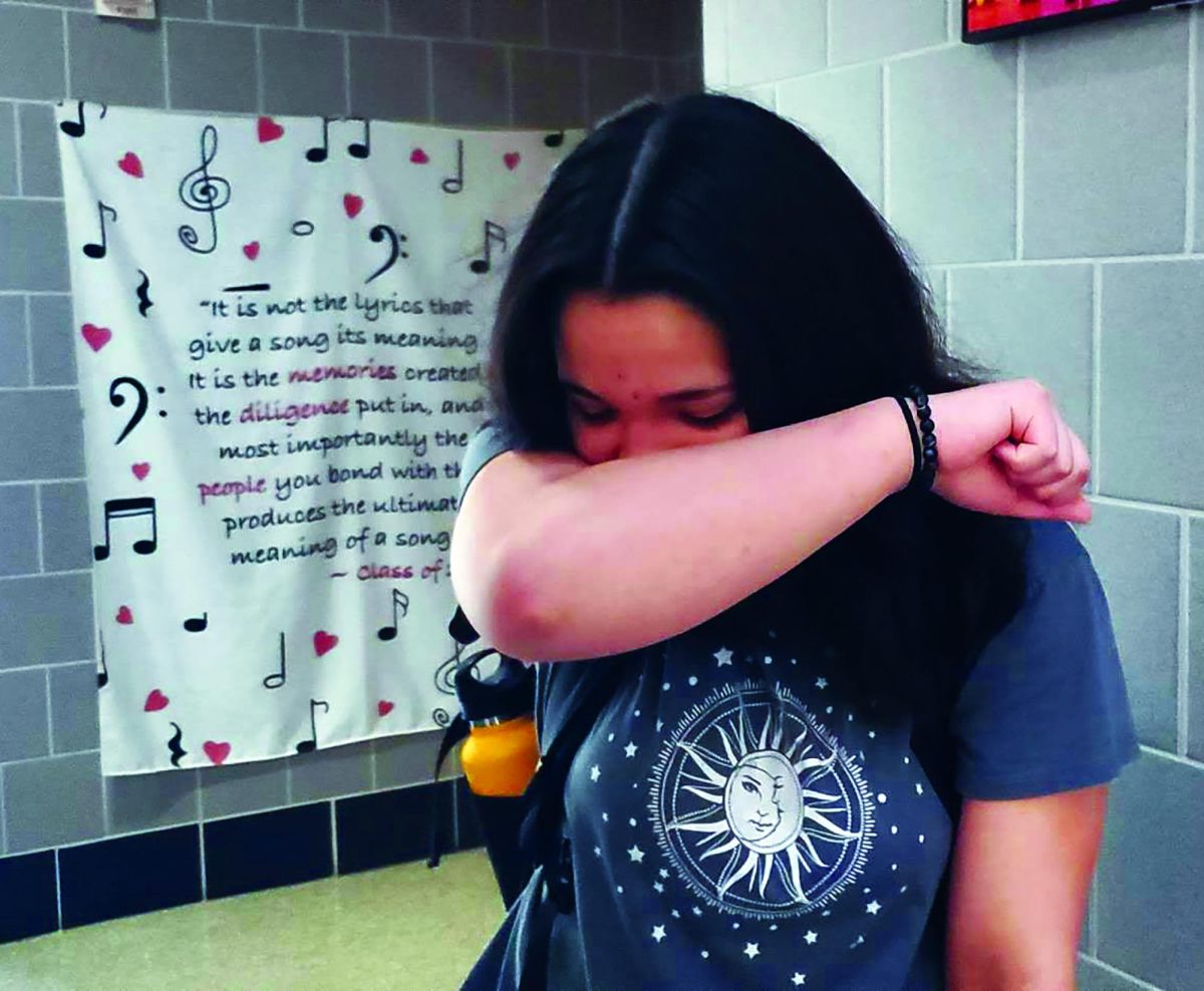 Releasing the germs…Letting out a sneeze, freshman Haley Lafredo gets rid of her spring germs. Lafredo suffers from allergies throughout the entire spring season.