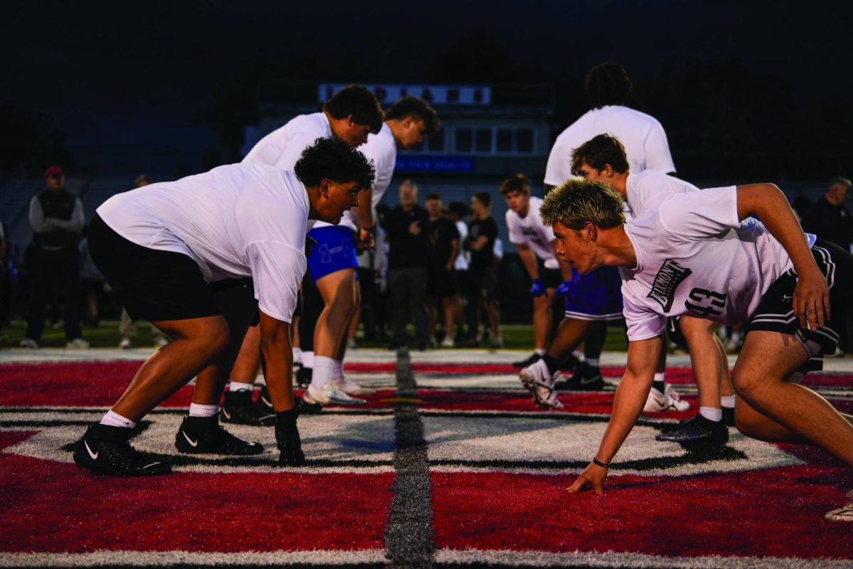 Rushing the protector…Preparing for the dominant pass rush, junior tackle Jacob Moises (left) stands tall in front of sophomore defensive end Tycho Bueters. The Buxmont Showcase offered invited high school athletes the chance to show off their skills in front of college coaches on May 8 at Souderton Area High School. 