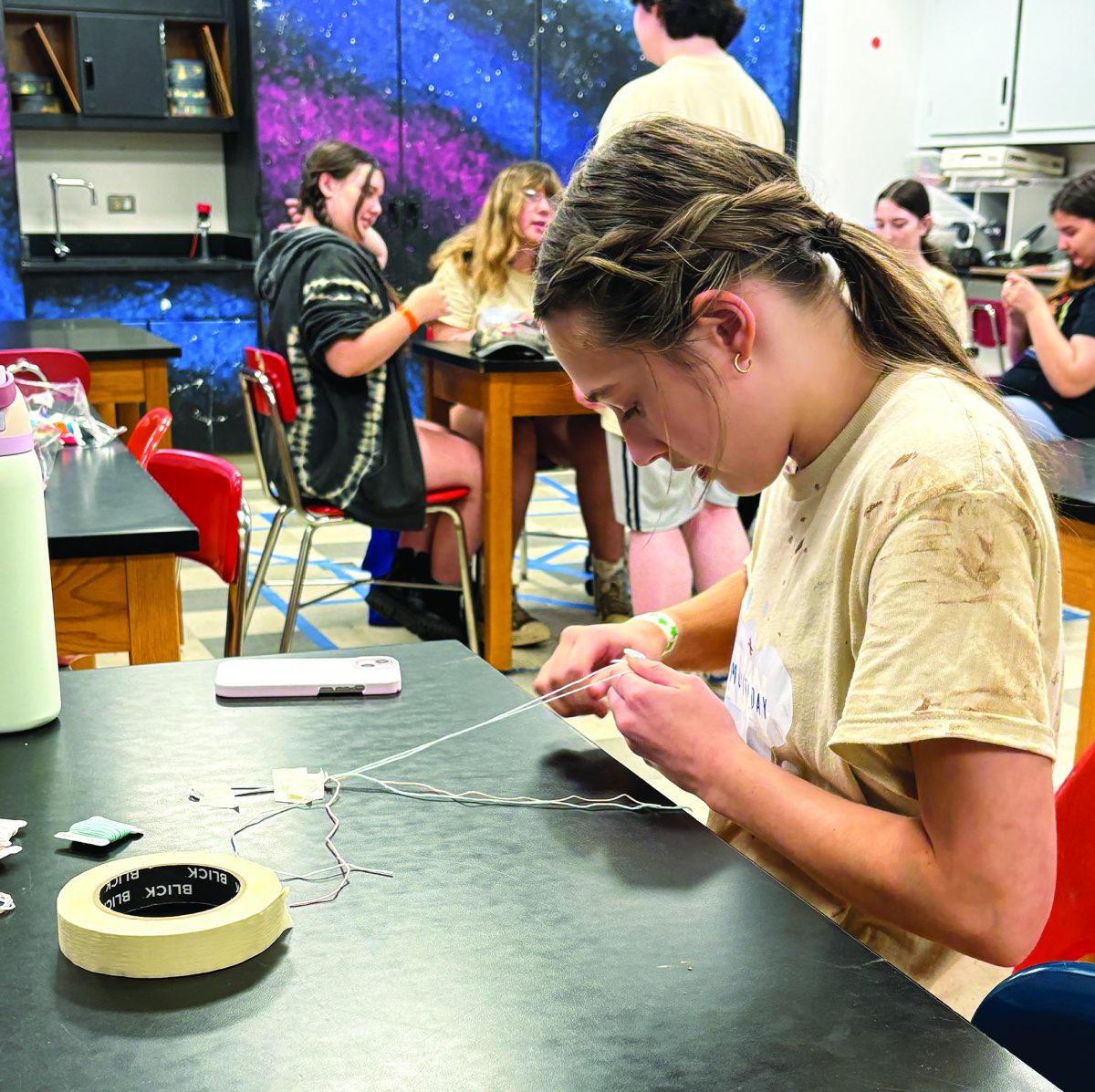 Crafting memories…Making bracelets to donate to people around the community, Indian Valley seventh grader Aubrey Holloway volunteers at the school’s May 16 Community Day.