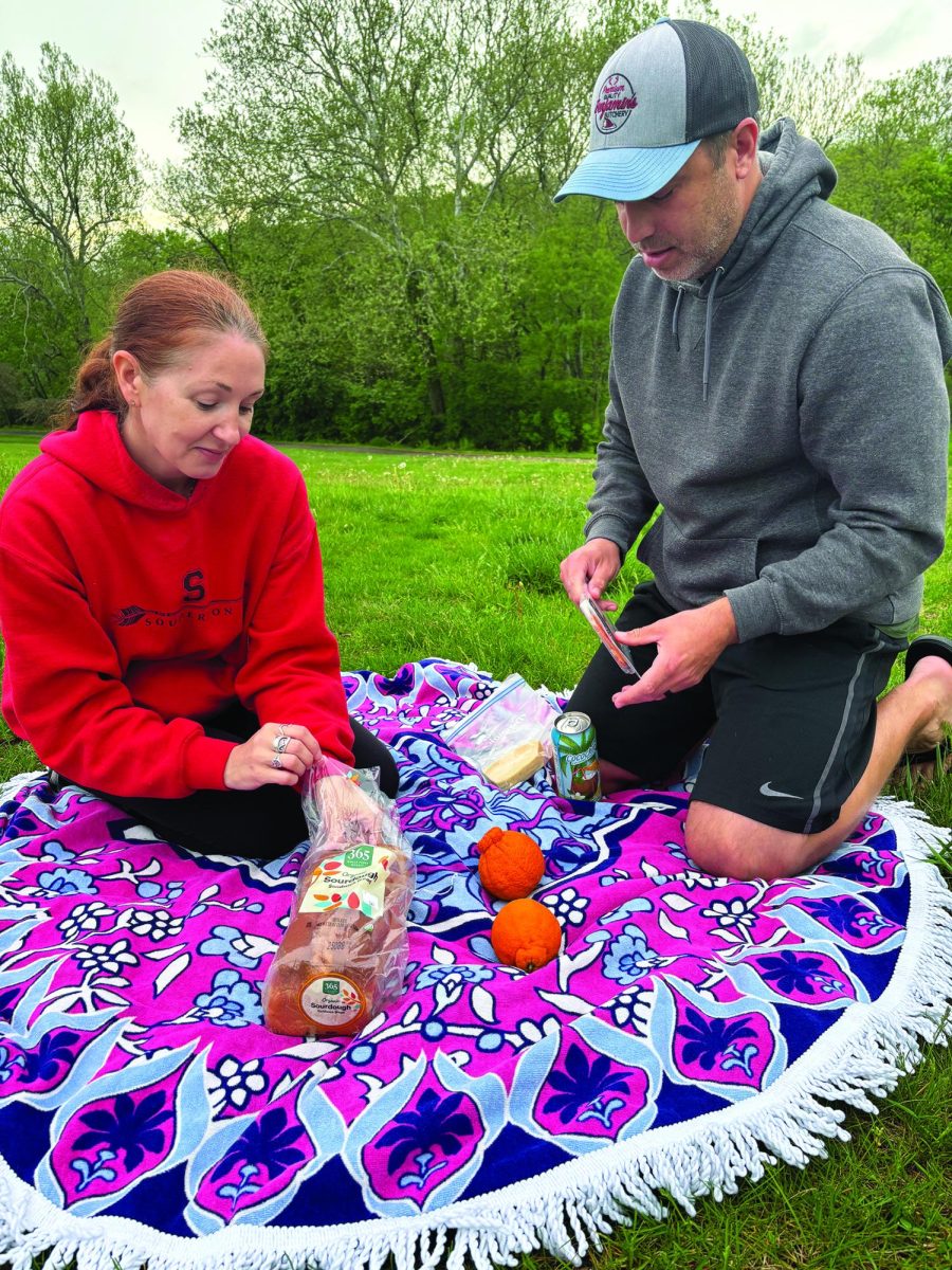 Delicious…Sharing laughs and food, Souderton residents Catherine and Anthony Santiago enjoyed a cozy May evening at Banbury Mopac Park in Franconia. The day was full of snacks, and fun moments under cloudy skies.