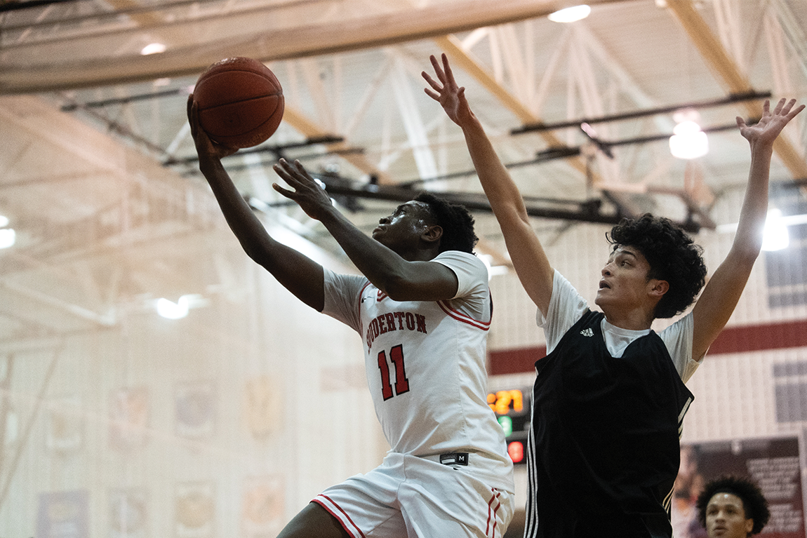 Shooting his shot...Working his way to the hoop, senior Nate Rusike takes a layup during a scrimmage against Antietam High School on November 26 in the high school’s gymnasium.