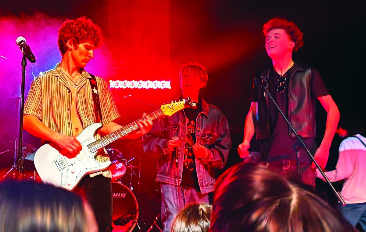 Sound check...Performing on stage at the 2026 High School Rock Band Showcase at Pennridge High School on January 16, guitarist Aidan Golla (left) and vocalists Jordan Waldenberger (center) and Matthew Kennedy display their musical talent.