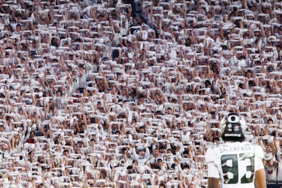 First place...Caught up in Beaver Stadium’s Penn State White Out crowd, Oregon tight end Roger Sallapaga II waits for the next play,. On September 27, 2025, Souderton alumni Christian Gresko took this photo and captioned it,“One player, 110,000 screaming fans.” On January 15, this photo earned Gresko the World Sports Photograohy award for American football.