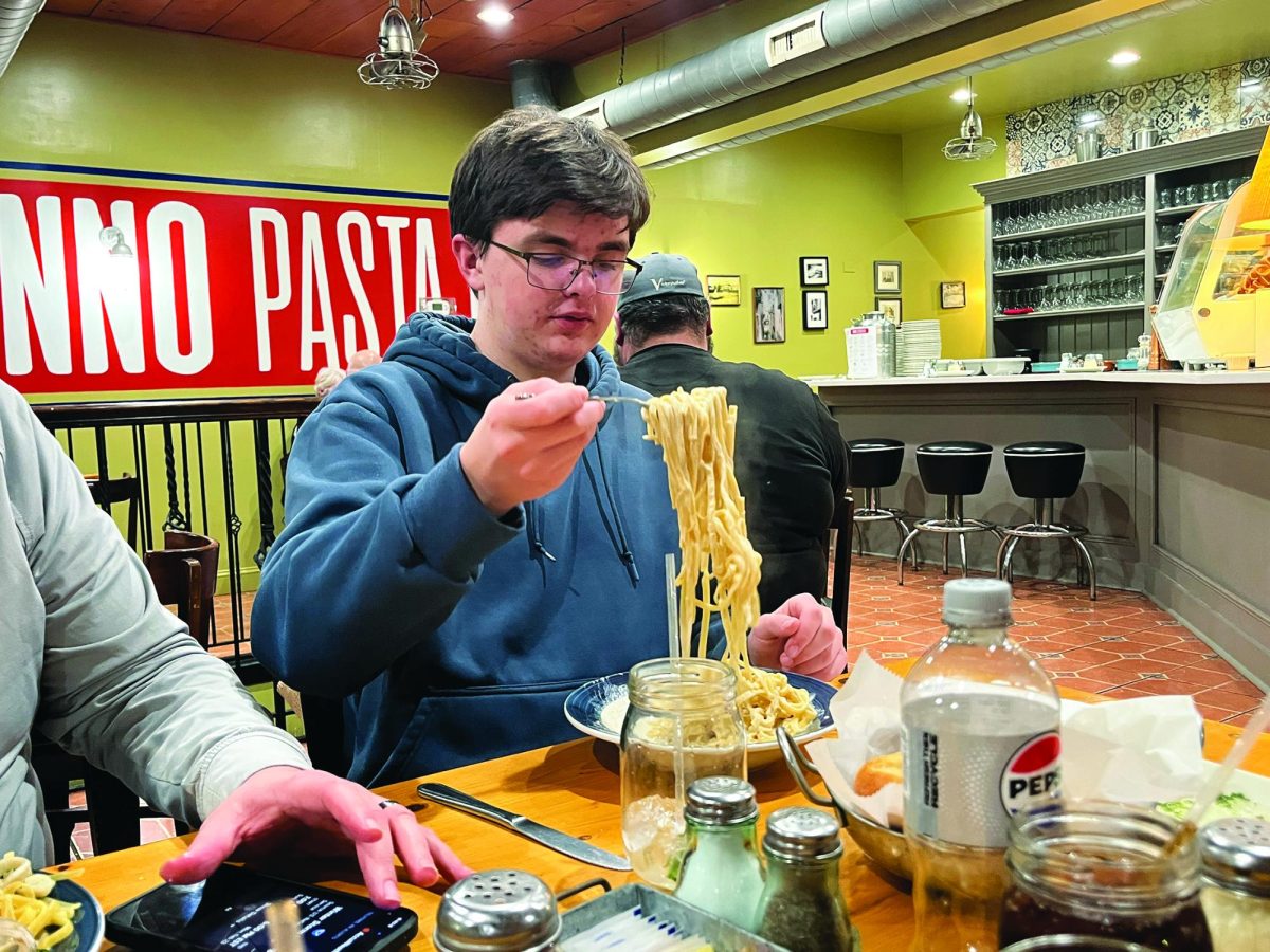 Enjoying a bite to eat…Taking a forkful of fettuccine Alfredo, junior Jack Boell enjoys his dinner at Nonno Pasta Bar in Souderton. The restaurant is open from 11 a.m. to 9 p.m. every day except Monday.