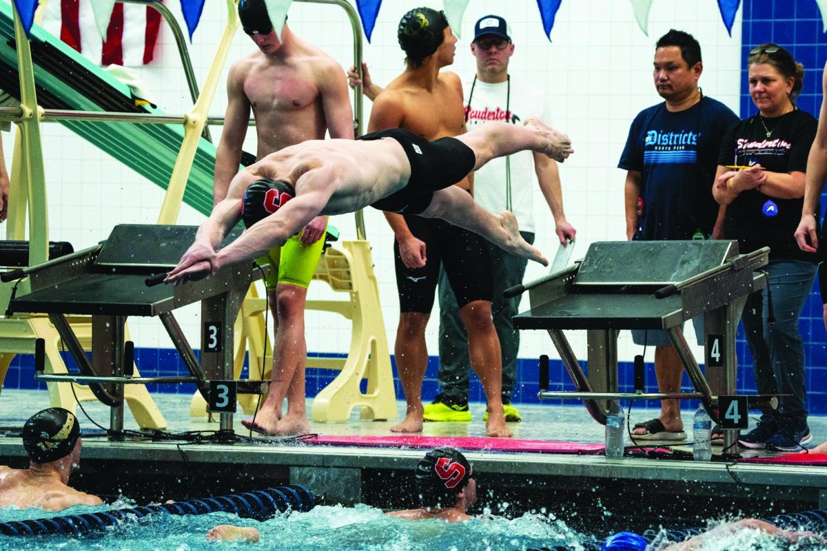 Swimmers, take your mark…Diving into the water for his leg of the 200-meter freestyle relay, sophomore Andrew Vincent does his best to put his team into a winning position. The boys team competed in leagues on February 13-14 and placed second overall with standout swims in the 100 fly and 400-meter freestyle relay.