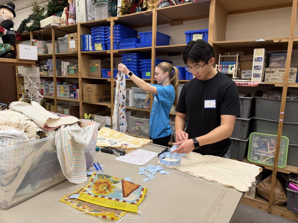 Lending a hand…Donating their time, freshman Ella Brewer and sophomore Jason Nguyen volunteer in the variety shop at Care and Share. Their volunteering took place on March 6. Care and Share, which is currently located in Souderton, will soon be moving to Harleysville.
