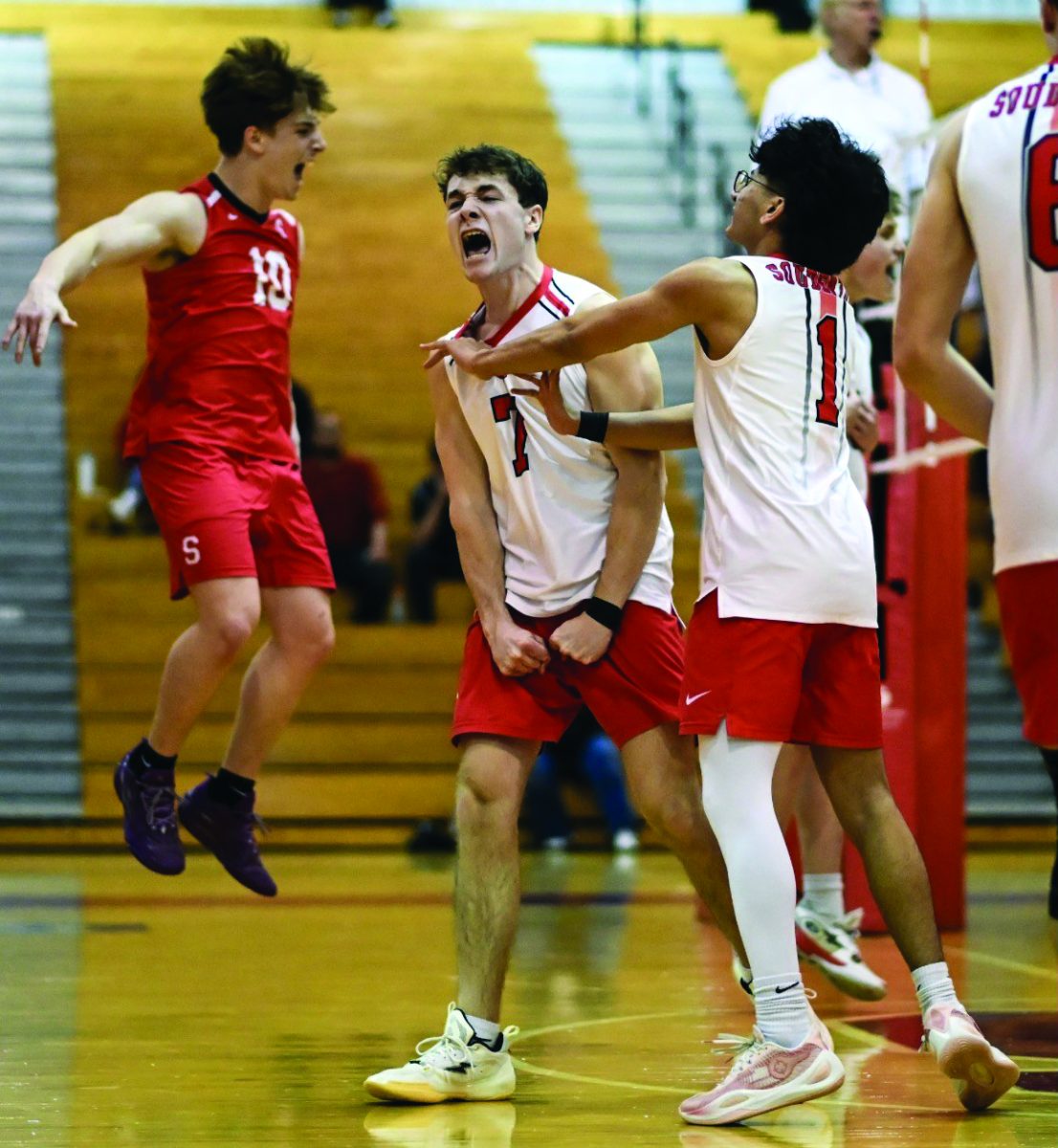 Spiking the competition...Scoring the match’s first points, (from left) seniors Anderson Drakas, Carson Pro and Krish Patel celebrate. The team fell to Central Bucks East High School 2-3 on March 20. 