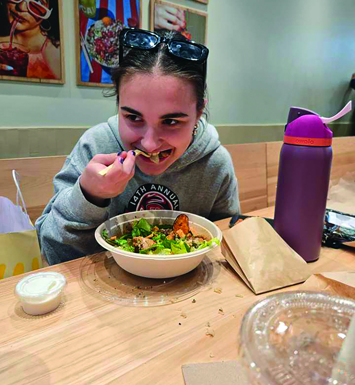 I came, I saw, I Cava’d...Chowing down on a make-your-own Cava bowl, sophomore Cassandra Shurtz enjoys grilled chicken, fiery broccoli and various other toppings for her meal. 