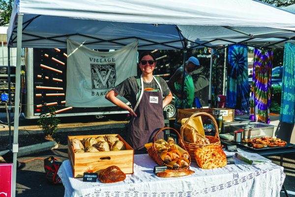 Ready to serve…Setting up her bakery stand at the Telford Night Market, The Village Bakery, Katherine Bollinger prepares for a day at the market. The stand is one of many local businesses offering homemade goods and treats at the market.
