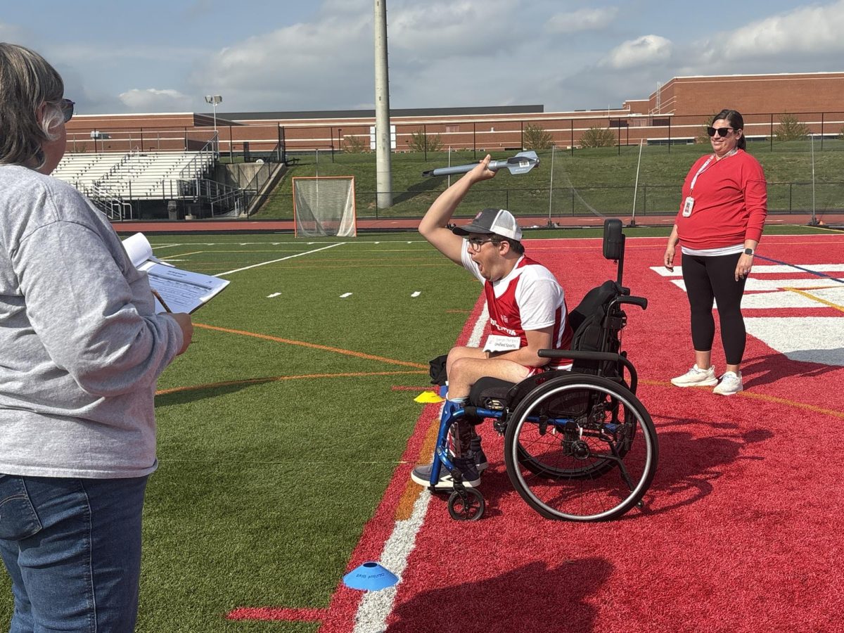 Aiming for the finish...Competing in a home meet on April 22, junior Adam Moyer prepares to throw the mini-javelin for the Unified Track team.